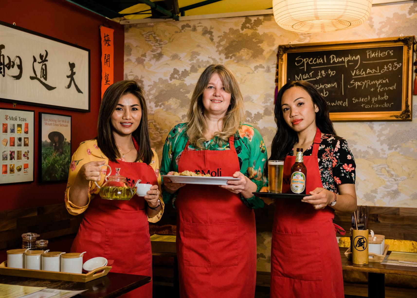 Moli Tea House team with tea and dumplings